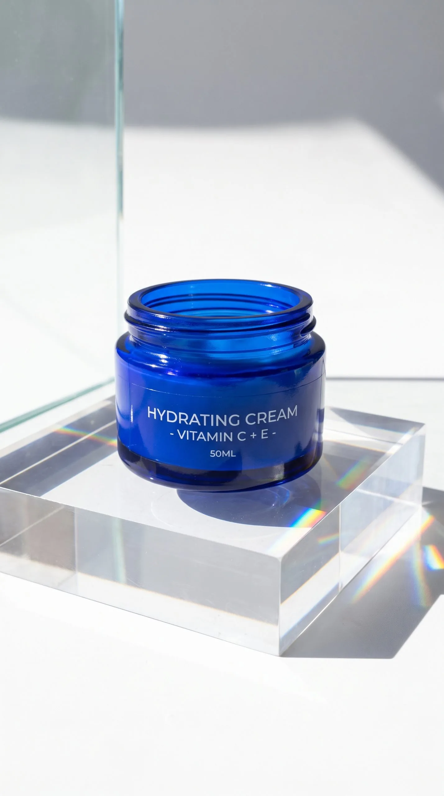 prism packshot effect on skincare serum in hard daylight with crisp refracted color