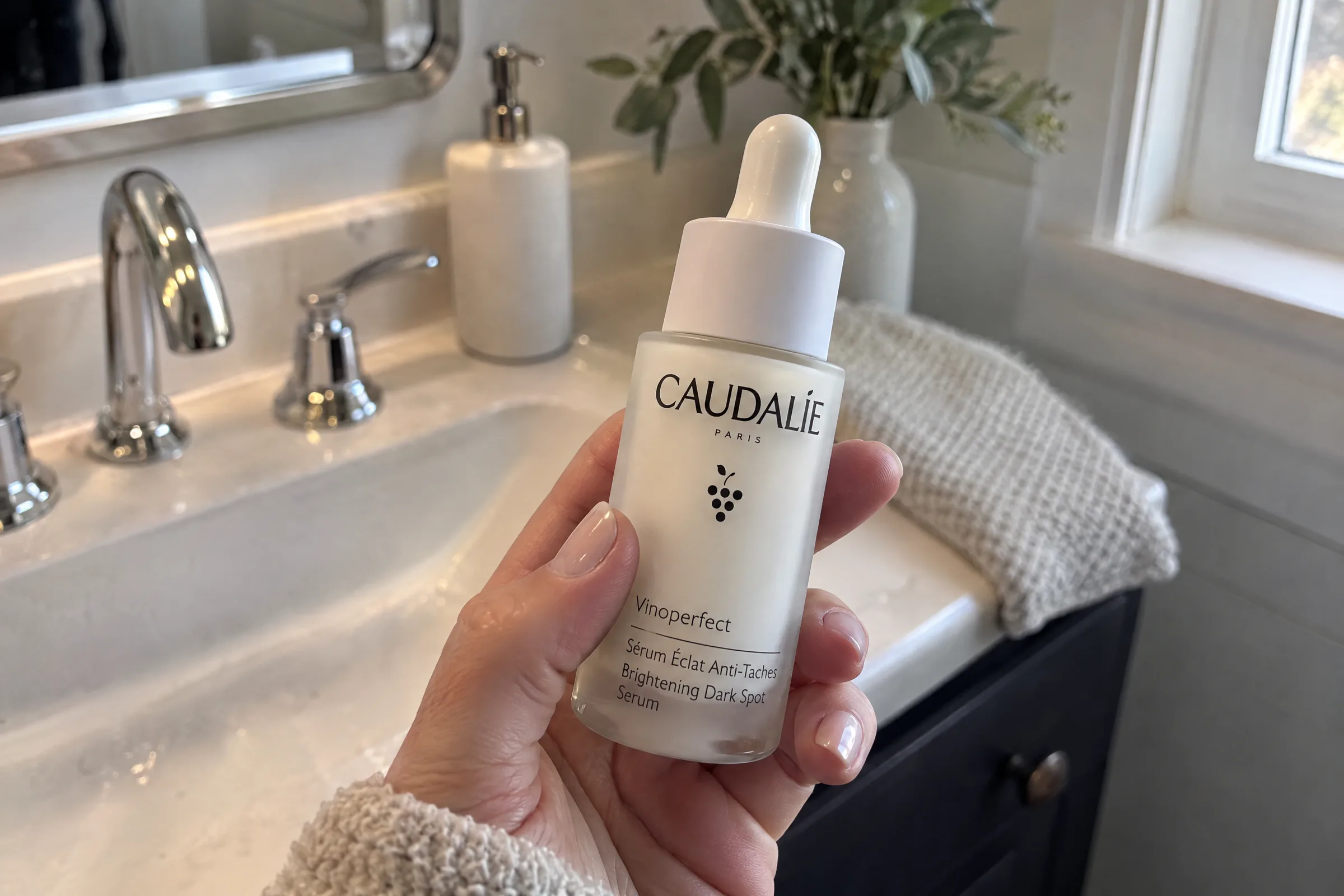 viral product ad 2026 — serum held above a bathroom counter
